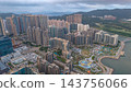 Hong Kong Oct 17 2022 Tseung Kwan O urban landscape and mountain backdrop 143756066