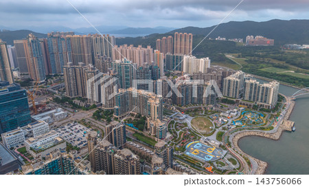 Hong Kong Oct 17 2022 Tseung Kwan O urban landscape and mountain backdrop 143756066