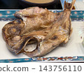 Grilled fish with salt, served on a plate 143756110