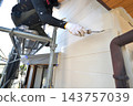 Renovation work on a detached house: A scene of a painter at work. 143757039
