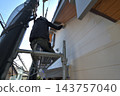 Renovation work on a detached house: A scene of a painter at work. 143757040