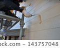 Renovation work on a detached house: A scene of a painter at work. 143757048