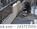 Renovation work on a detached house: A scene of a painter at work. 143757050