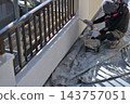 Renovation work on a detached house: A scene of a painter at work. 143757051