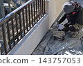 Renovation work on a detached house: A scene of a painter at work. 143757053