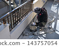 Renovation work on a detached house: A scene of a painter at work. 143757054