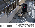 Renovation work on a detached house: A scene of a painter at work. 143757055