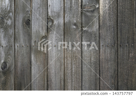 Vertical Weathered Wooden Plank Wall Texture with Natural Knots and Nails 143757797