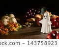 Halloween image of ghosts and harvest 143758923