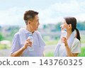 Senior couple rehydrating during exercise Senior couple rehydrating during exercise 143760325