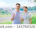 Senior couple rehydrating during exercise Senior couple rehydrating during exercise 143760326