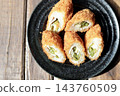 Asparagus and cheese wrapped in meat and deep-fried; a fried side dish. 143760509