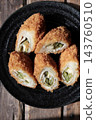 Asparagus and cheese wrapped in meat and deep-fried; a fried side dish. 143760510