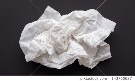 Crumpled White Tissue Paper Isolated on Black Background Crumpled White Tissue Paper Isolated on Black Background 143760627