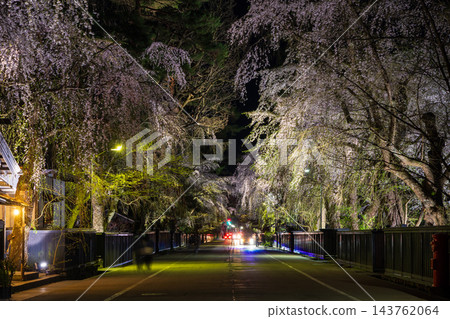 Springtime in Semboku City, Akita Prefecture: Kakunodate Samurai Residence Street, one of Japan's Top 100 Cherry Blossom Viewing Spots, with illuminated cherry blossoms at night. Springtime in Semboku City, Akita Prefecture: Kakunodate Samurai Residence Street, one of Japan's Top 100 Cherry Blossom Viewing Spots, with illuminated cherry blossoms at night. 143762064
