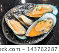 Big Fresh Mussels Served on a Plate 143762287
