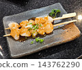 Grilled Scallop Skewers on a Plate 143762290