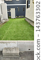 Lawn gardens and outdoor facilities spread between houses 143763302
