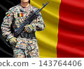 Belgium flag with soldier holding assault rifle 143764406