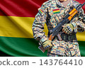 Bolivia flag with soldier holding assault rifle 143764410