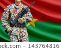 Burkina Faso flag with soldier holding assault rifle 143764816