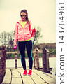 Young sports woman taking break after workout 143764961