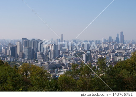 Famous N Seoul Tower landmark and urban skyline view from Namsan Mountain Famous N Seoul Tower landmark and urban skyline view from Namsan Mountain 143766791