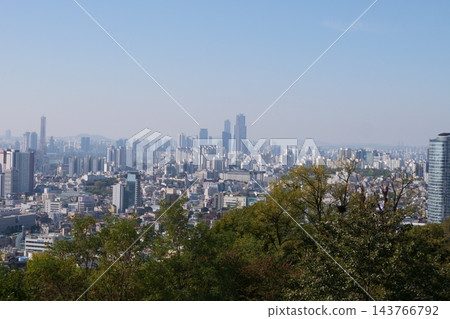 Famous N Seoul Tower landmark and urban skyline view from Namsan Mountain Famous N Seoul Tower landmark and urban skyline view from Namsan Mountain 143766792