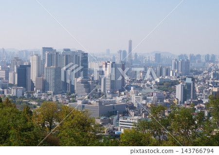 Famous N Seoul Tower landmark and urban skyline view from Namsan Mountain Famous N Seoul Tower landmark and urban skyline view from Namsan Mountain 143766794