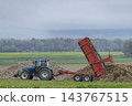 Tractor trailer dumping sugar beets during harvest in Marne, France Tractor trailer dumping sugar beets during harvest in Marne, France 143767515