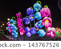 Colorful illuminated floral lanterns glowing at night festival Colorful illuminated floral lanterns glowing at night festival 143767526
