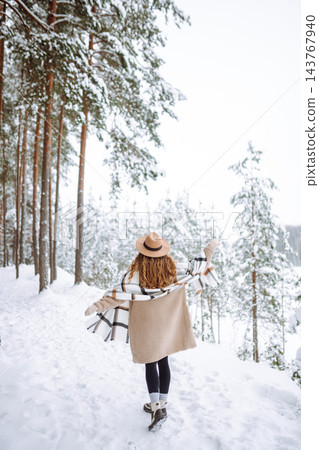 Beautiful woman posing in winter forest. Great winter weather and atmosphere. Christmas. Beautiful woman posing in winter forest. Great winter weather and atmosphere. Christmas. 143767940