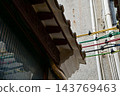 Close-up of the colorful electric wire at the rooftop of Chinese classic roof of traditional building, Chinese architecture in China. 143769463