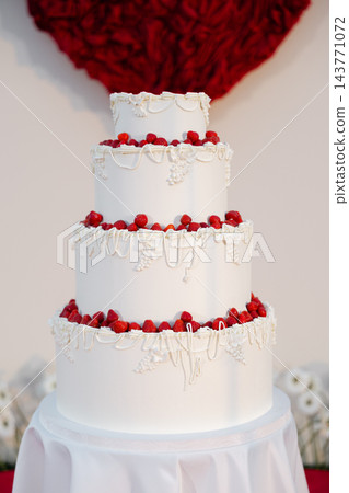 White tiered wedding cake with fresh strawberries White tiered wedding cake with fresh strawberries 143771072