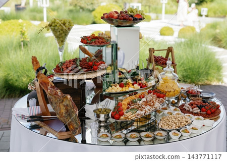 Wedding banquet catering a delicious buffet spread outdoors 143771117