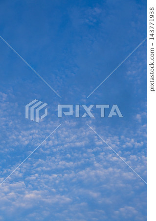 Blue sky viewed from above with a broad, softly textured layer of scattered clouds below Blue sky viewed from above with a broad, softly textured layer of scattered clouds below 143771938