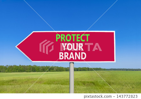 Protect your brand words symbol. Concept words Protect your brand on beautiful red road sign. Beautiful blue sky green grass background. Business and protect your brand concept. Copy space. Protect your brand words symbol. Concept words Protect your brand on beautiful red road sign. Beautiful blue sky green grass background. Business and protect your brand concept. Copy space. 143772823