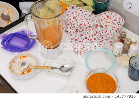 Squash caviar is being prepared on a kitchen counter, with blended squash, a bowl of puree, a blender, and utensils visible during food preparation Squash caviar is being prepared on a kitchen counter, with blended squash, a bowl of puree, a blender, and utensils visible during food preparation 143777926