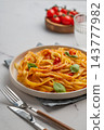 Homemade Tagliatelle Pasta with Tomato Sauce, Basil and Parmesan 143777982