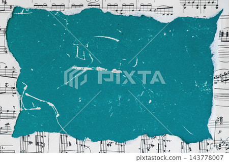 Torn turquoise paper frame on sheet music background mockup. Flat lay mockup of piece of torn turquoise teal paper with copy space placed over a background of vintage sheet music notes Torn turquoise paper frame on sheet music background mockup. Flat lay mockup of piece of torn turquoise teal paper with copy space placed over a background of vintage sheet music notes 143778007