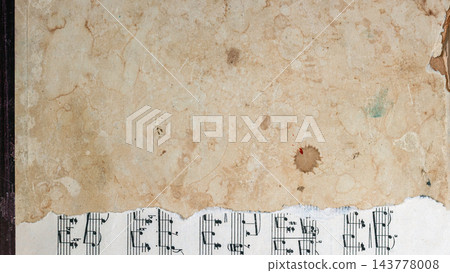 Vintage stained paper texture over sheet music background mockup. High angle view of aged, torn, stained beige paper overlapping sheet music page. Grunge collage background mockup, copy space Vintage stained paper texture over sheet music background mockup. High angle view of aged, torn, stained beige paper overlapping sheet music page. Grunge collage background mockup, copy space 143778008