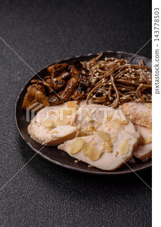 A bowl featuring slices of boiled chicken fillet, buckwheat noodles, and mushrooms A bowl featuring slices of boiled chicken fillet, buckwheat noodles, and mushrooms 143778503