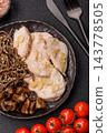A bowl featuring slices of boiled chicken fillet, buckwheat noodles, and mushrooms 143778505
