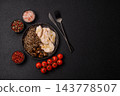 A bowl featuring slices of boiled chicken fillet, buckwheat noodles, and mushrooms 143778507