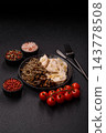 A bowl featuring slices of boiled chicken fillet, buckwheat noodles, and mushrooms 143778508