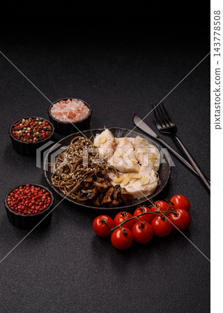 A bowl featuring slices of boiled chicken fillet, buckwheat noodles, and mushrooms A bowl featuring slices of boiled chicken fillet, buckwheat noodles, and mushrooms 143778508