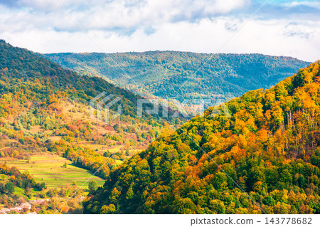 Carpathian mountain landscape on a sunny afternoon. outdoor adventure with stunning view in evening light. outskirts of Volosianka village, Ukraine Carpathian mountain landscape on a sunny afternoon. outdoor adventure with stunning view in evening light. outskirts of Volosianka village, Ukraine 143778682