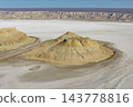 A close-up view of the layered, isolated hills of Karinjalik from an oblique angle above. 143778816