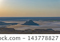 The isolated hill of Karinjalik stands under the warm evening sky. 143778827