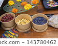 Dried Edible Flower Petals in Biodegradable Paper Bowls for Culi 143780462